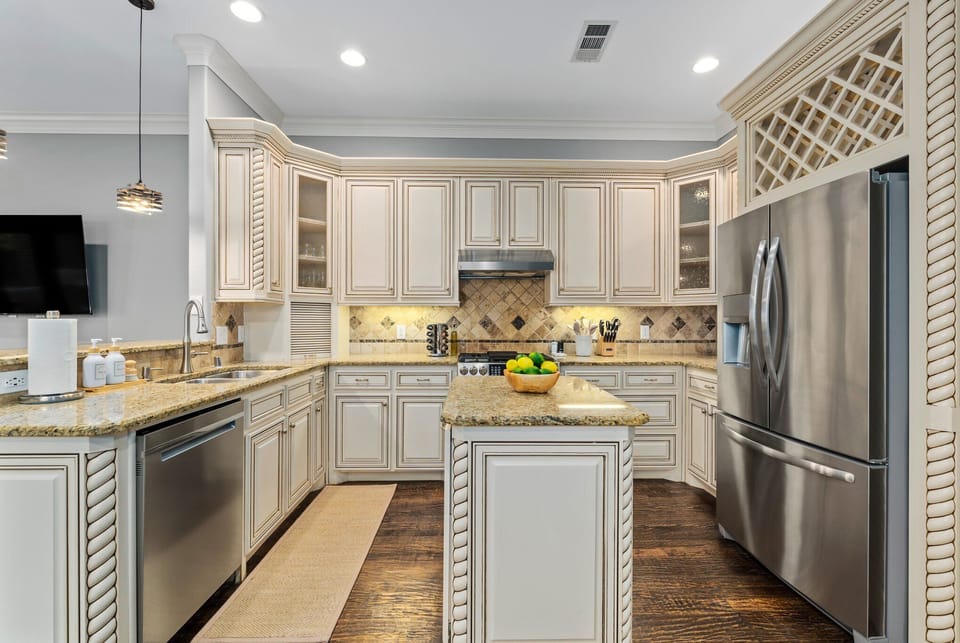 The kitchen layout is optimized for cooking and food prep, with ample counter space and plenty of storage. The 5-burner stove gives home cooks and professional chefs the ability to create culinary masterpieces with ease and efficiency.