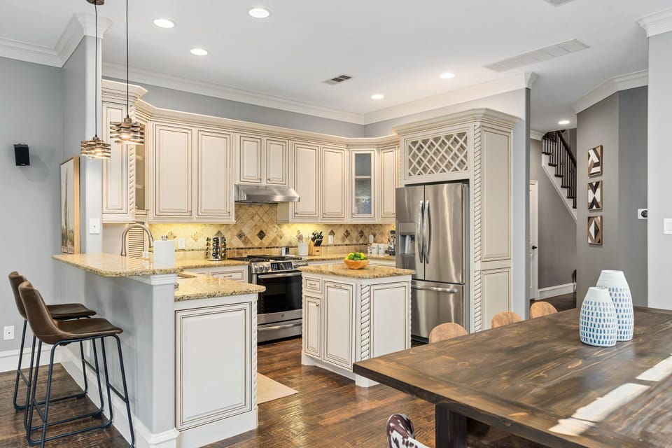 High-quality finishes, stylish fixtures, and top-of-the-line appliances are used throughout this kitchen to create a sleek and modern look while simultaneously providing a functional and efficient space.