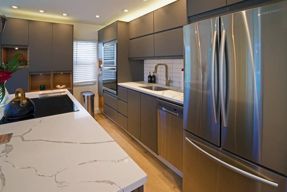Modern, sleek kitchen has everything you need with lots of storage!