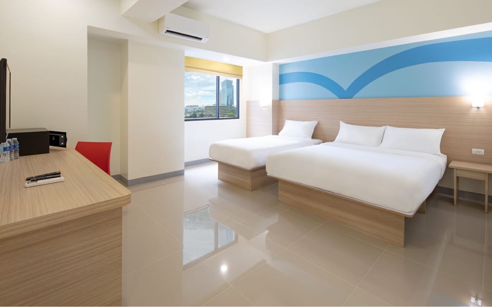 Triple Room | Down comforters, in-room safe, desk, laptop workspace