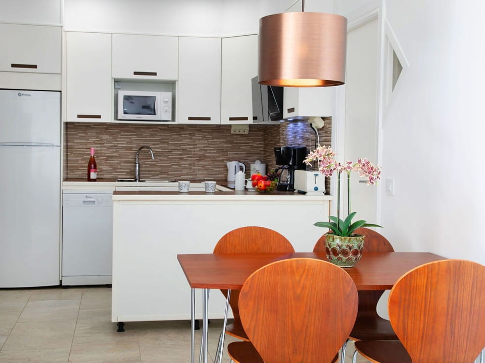 Cabinetry, Furniture, Property, Building, Countertop, Table, Plant, Wood, Lighting, Orange