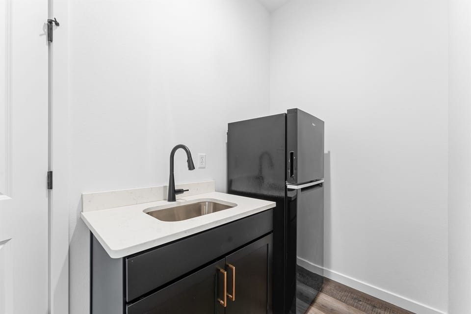 More snacks? More drinks? This extra fridge and sink upstairs has you covered.