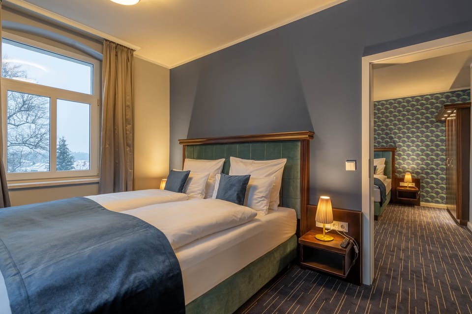 Deluxe Quadruple Room | Premium bedding, in-room safe, desk, laptop workspace