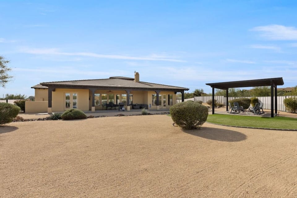 Spacious backyard that is fully fenced with a pest control wire lining
