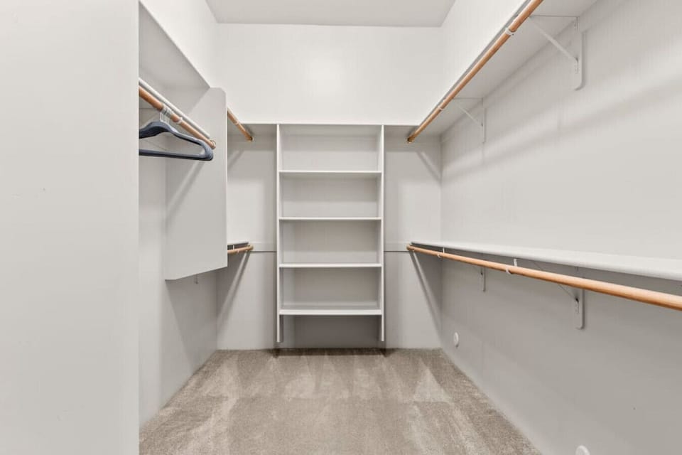 Walk in closet located in master bedroom
