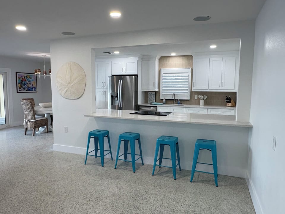 Open kitchen with counter height bar 