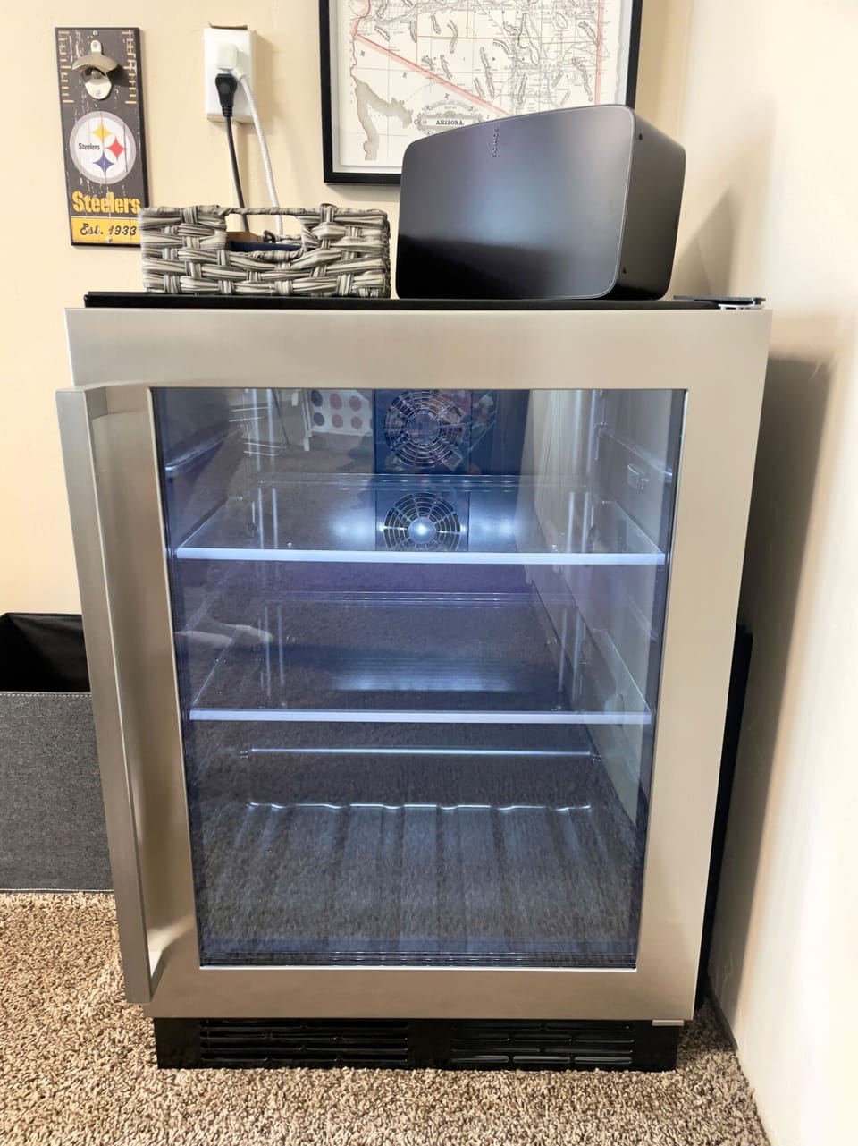 Beverage fridge & sonos 5 wifi speaker in Game room