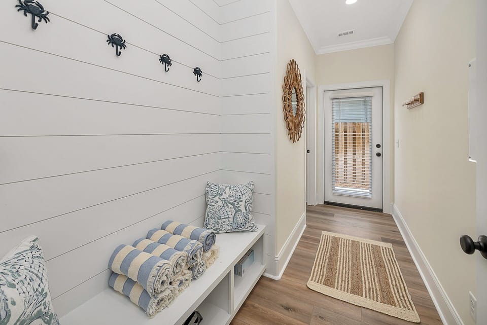 Access to the pool area with built-in cabinets and hooks that are perfect after enjoying the pool