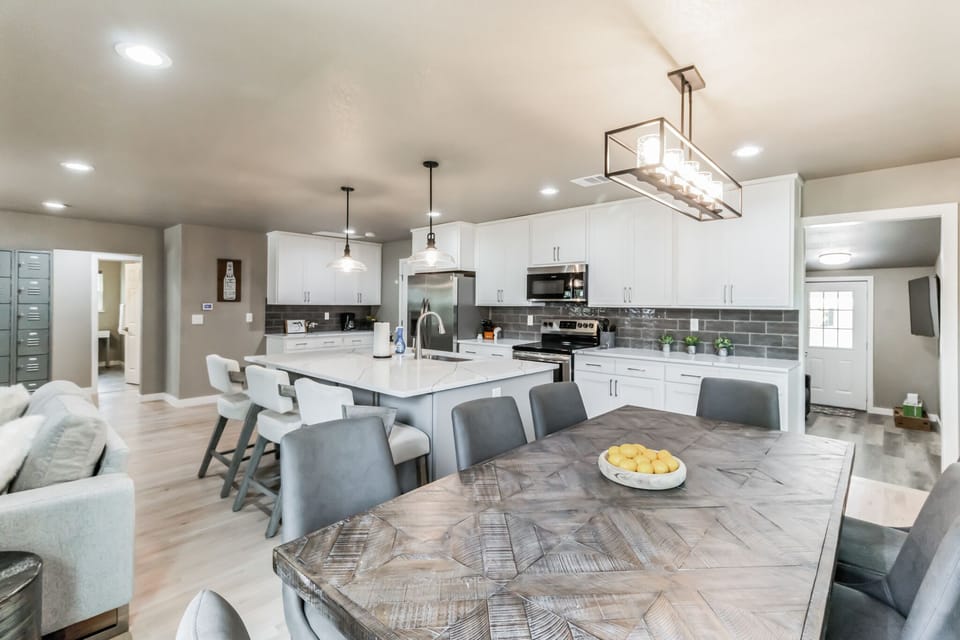 Large dining table seats 8, plus 3 at the island
