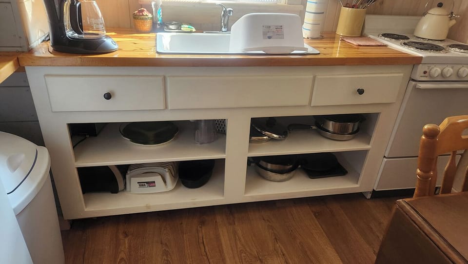 Pots and pan, toaster, toaster oven, measuring cups, utensils and more provided