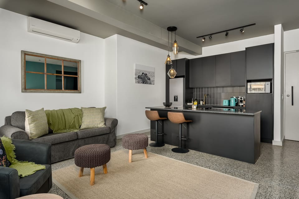 Deluxe Apartment | Living area | 50-inch flat-screen TV with cable channels, TV, Netflix