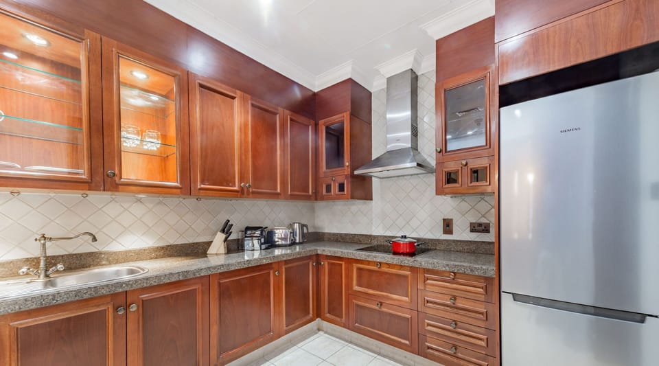 Luxury Apartment | Private kitchen | Fridge, microwave, cleaning supplies, paper towels