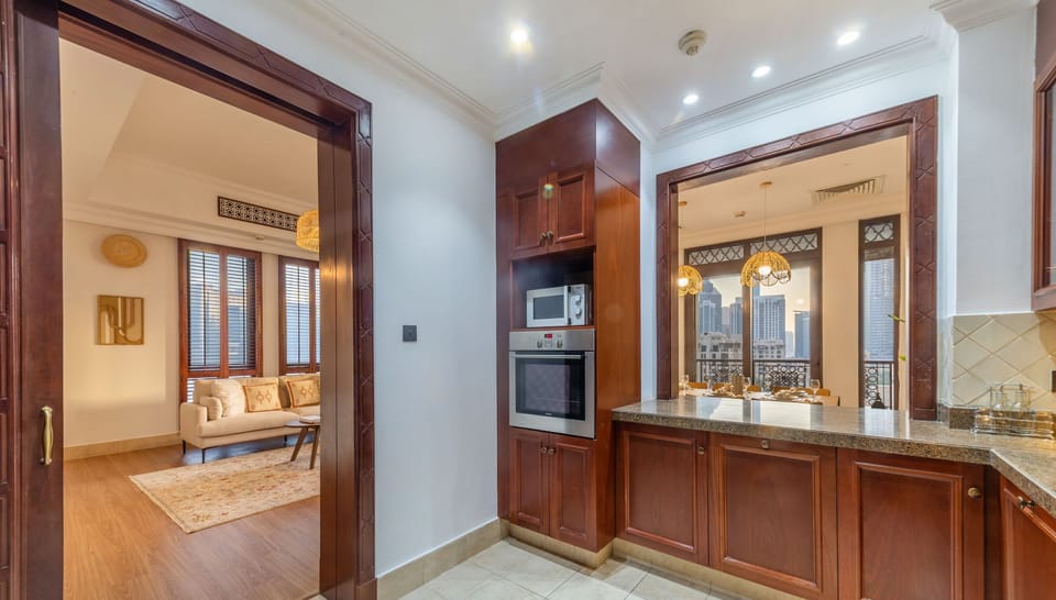 Luxury Apartment | Private kitchen | Fridge, microwave, cleaning supplies, paper towels