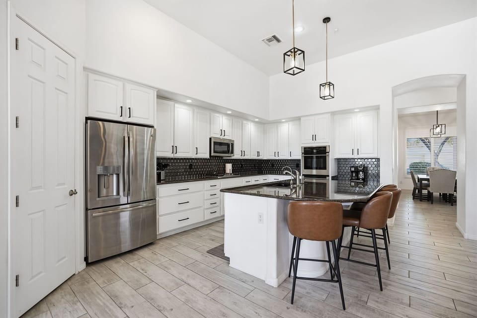 The convenient kitchen island can fit up to four guests at the counter for a snack or meal.