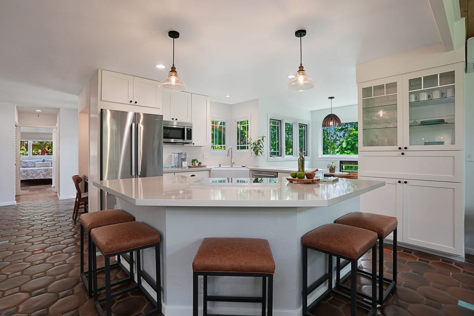 The kitchen’s huge island brings people together—ideal for cooking or entertaining friends.