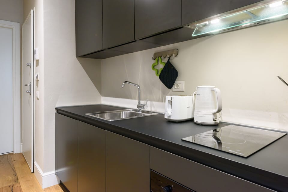 Comfort Apartment | Private kitchen | Full-size fridge, microwave, oven, stovetop