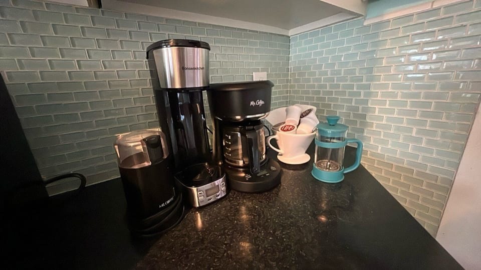 Coffee maker, single cup Keurig and a coffee grinder, french press, and a pour over.