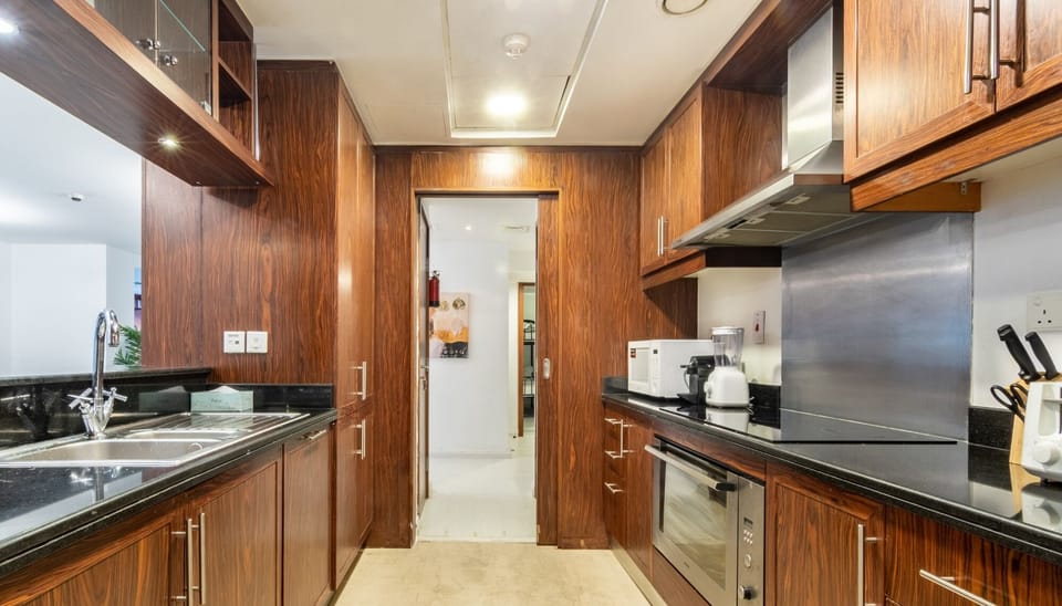 Luxury Villa | Private kitchen | Fridge, microwave, cleaning supplies, paper towels