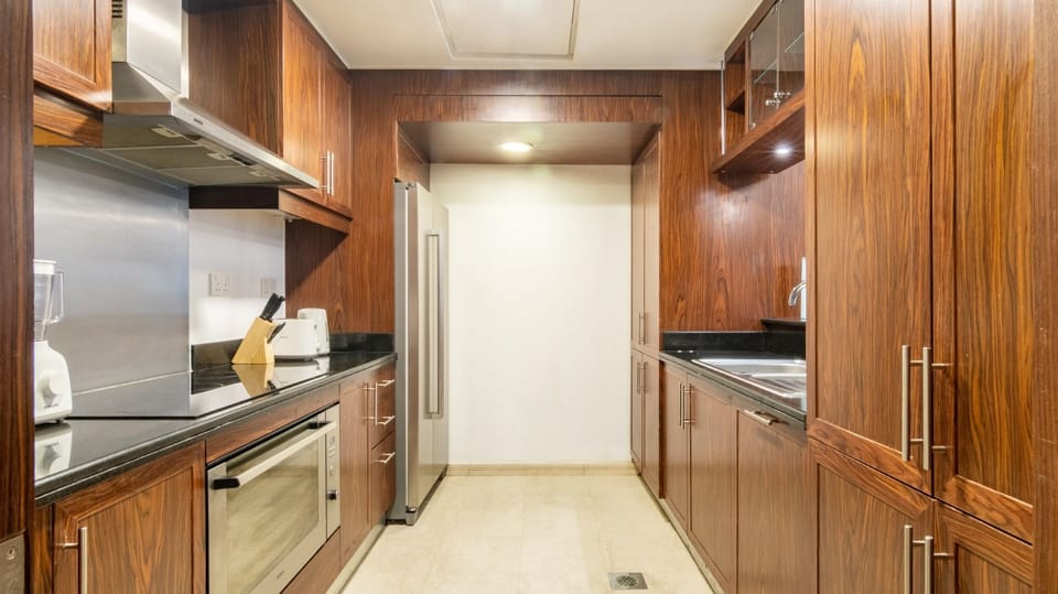 Luxury Villa | Private kitchen | Fridge, microwave, cleaning supplies, paper towels
