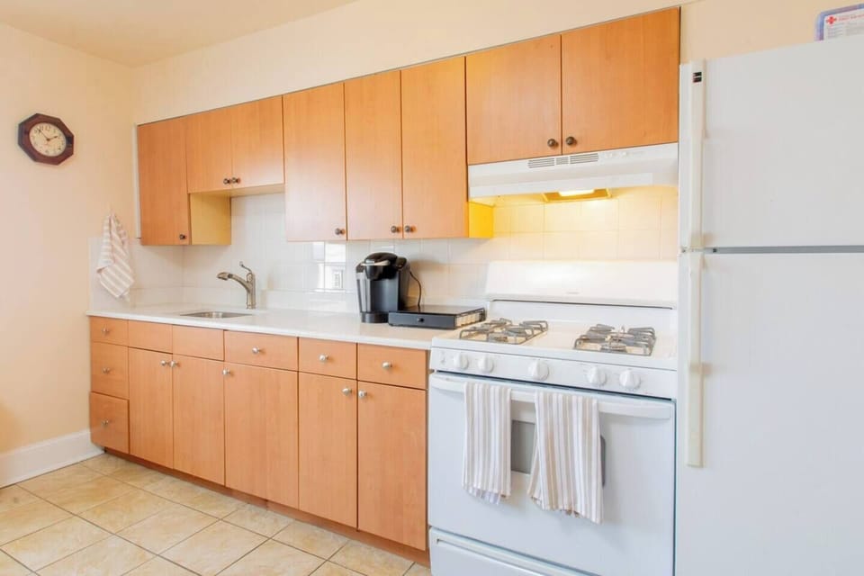 A fully stocked kitchen with utensils and all the amenities to cook with. Have a cup of coffee from the Keurig.