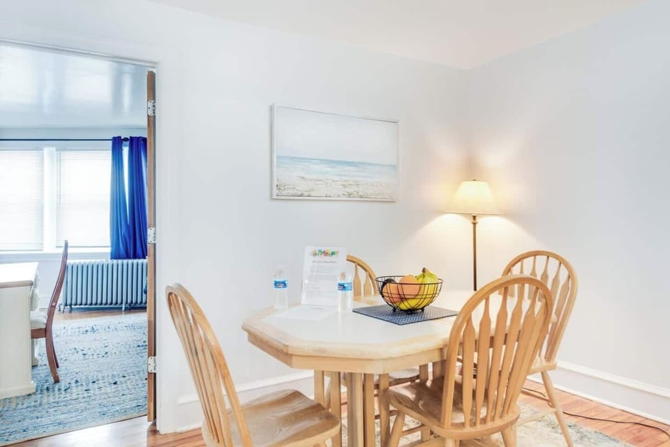 The dining area has a table that fits 4 as shown, but has a hidden 12 inch section underneath that easily and automatically can be moved into place to add room for 2 more chairs.