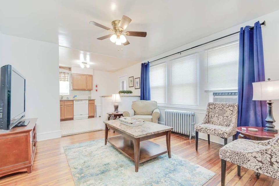 There is a large Living Room with a big ROKU TV that opens into a fully stocked kitchen with a dishwasher. The walls were freshly painted this spring and the wooden floors were re-done too. 