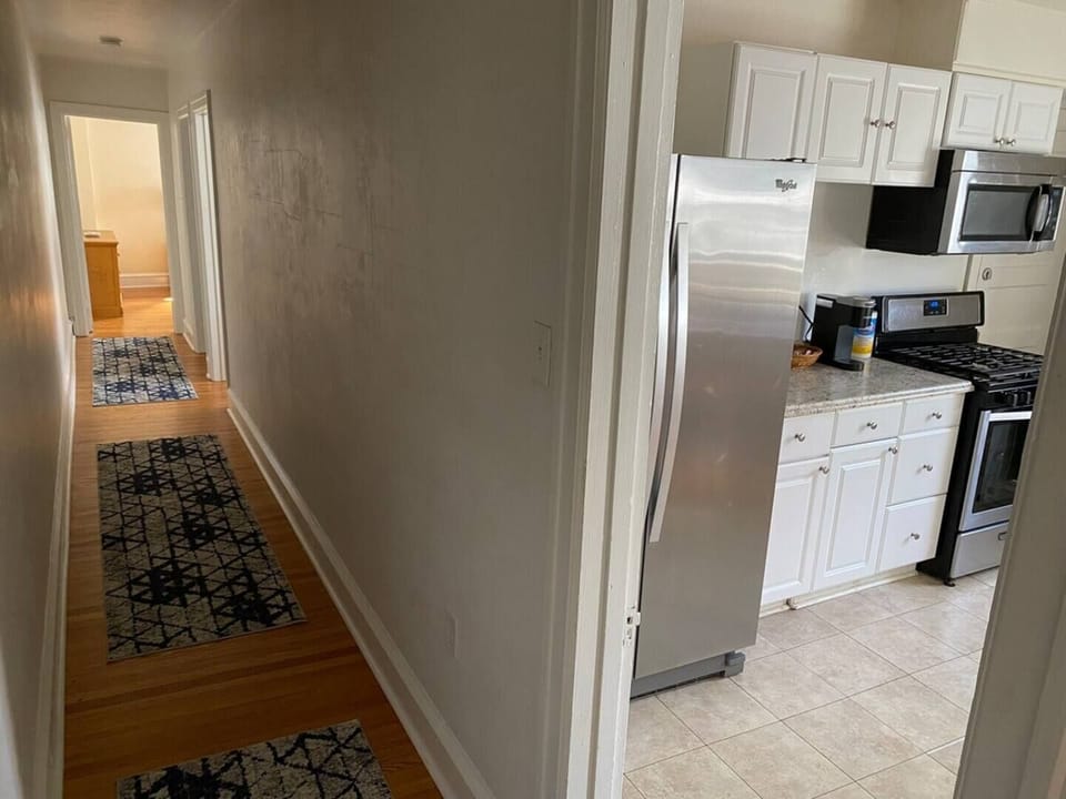 Hallway from kitchen leading towards the bedrooms.
