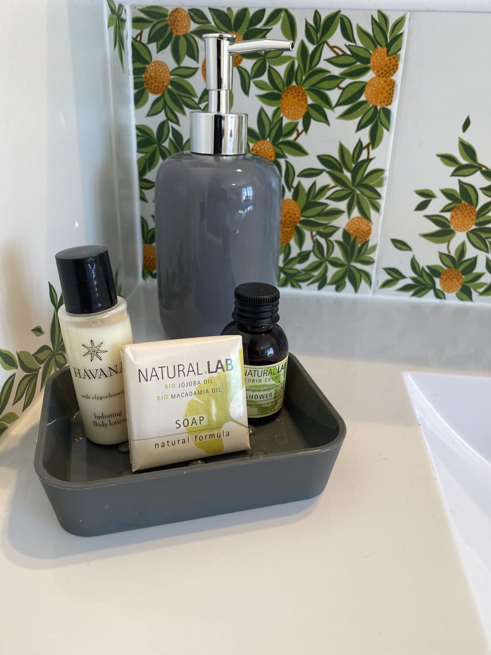Shower, designer toiletries, hair dryer, towels