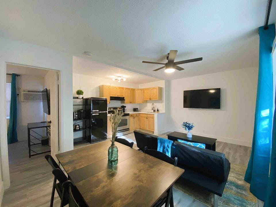 Discover chic, connected living in our space, where living room, dining, and kitchenette unite!