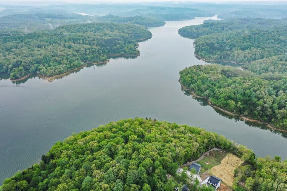 cart path to the lake, furthest house to the left next to public land