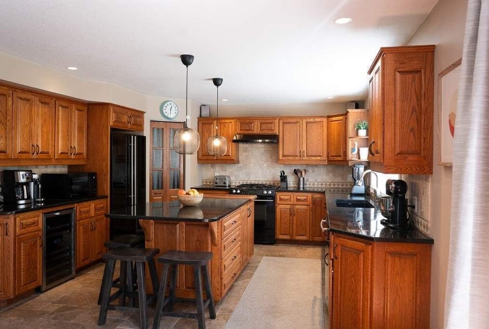 Kitchen with wine fridge, pantry and coffee station