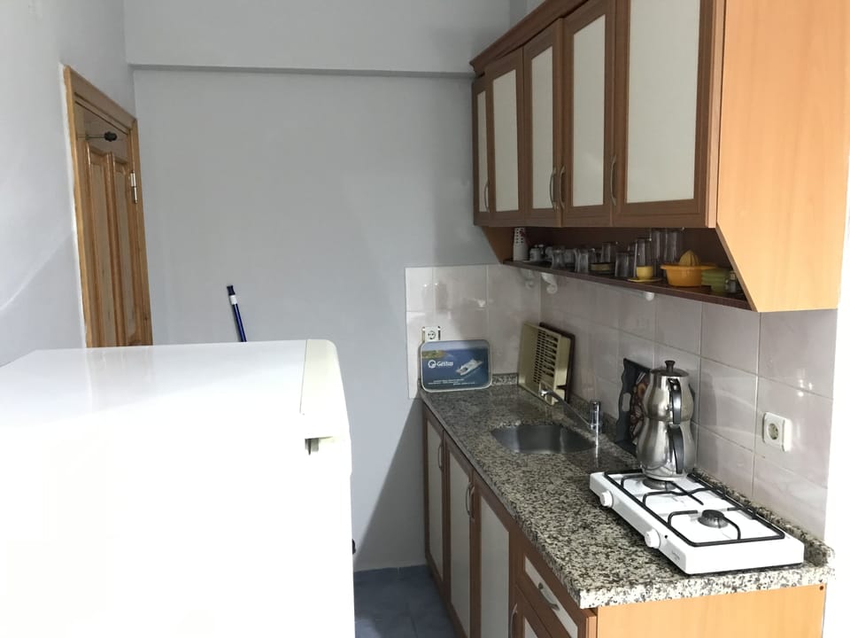 Quadruple Room | Private kitchenette | Mini-fridge, cookware/dishes/utensils, dining table