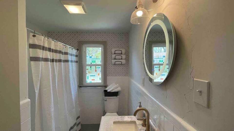 * Full bath with tub
* Lighted round mirror for precise make up or shaving usage
* Mirror has bluetooth speaker. Listen to your favorite music or podcast while soaking in the bathtub