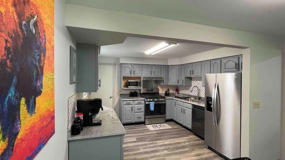 * Updated kitchen has all the appliances and utensils you will need for a comfortable short or long term stay
* Natural stone countertop
* Gas stove