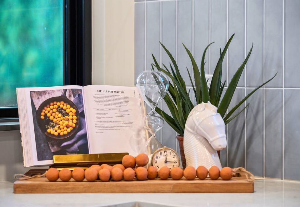 Culinary inspiration awaits in our cozy nook! With a recipe book open and ready, who knows what delicious meals you'll whip up.