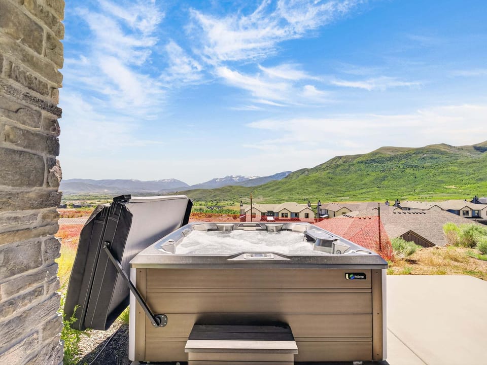 Soak in the private hot tub while enjoying breathtaking mountain views and fresh mountain air.