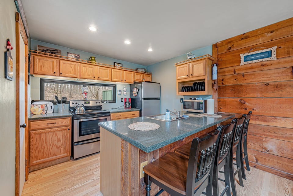 Kitchen with full size stove and dishwasher