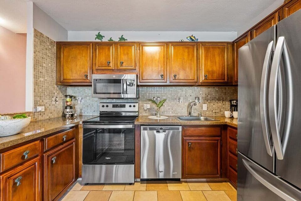 Stainless steel appliances and granite counters for a premium experience