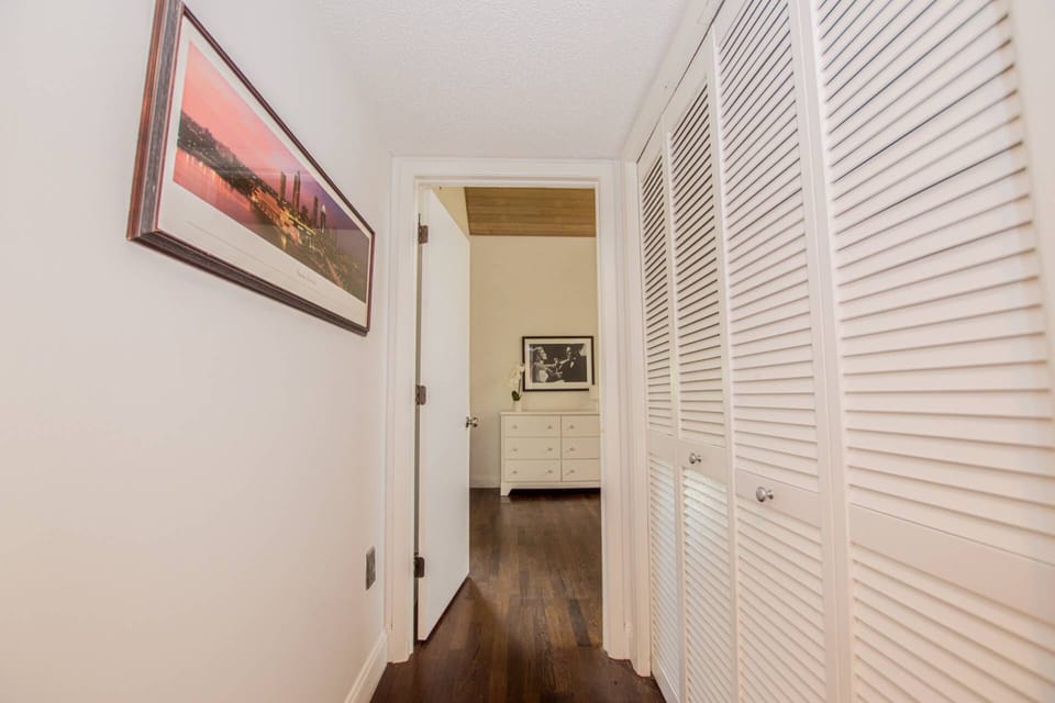 Upstairs hallway storage area with washer & dryer for your convenience!