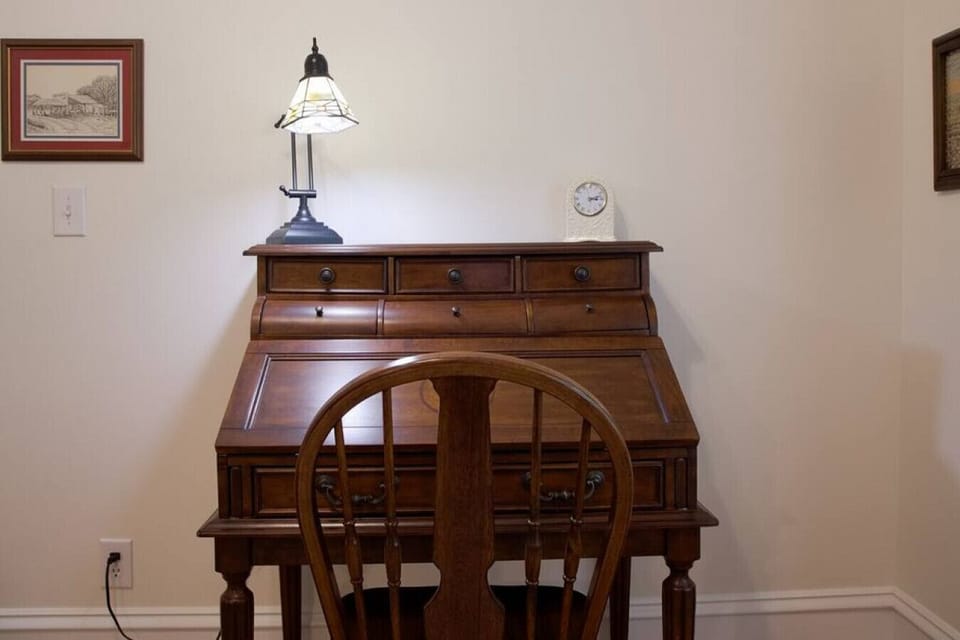 this antique desk opens up to a flat surface for writting, reading, or to set your lap top on