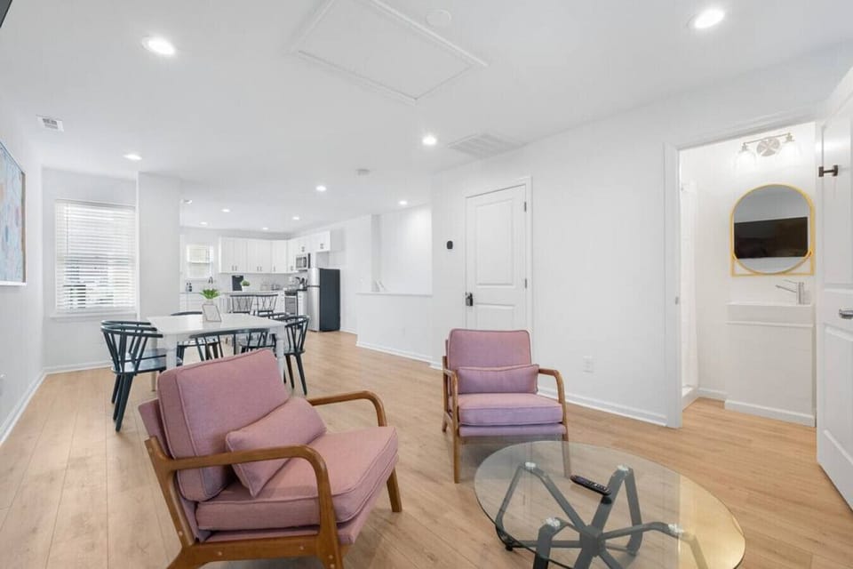 Endless space unfolds before your eyes in this expansive open concept living room and kitchen, inviting you to revel in its grandeur.