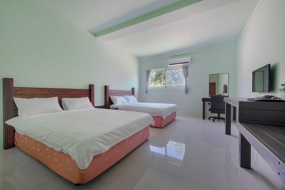 Garden View Quadruple Room | Desk, blackout drapes, free WiFi, bed sheets