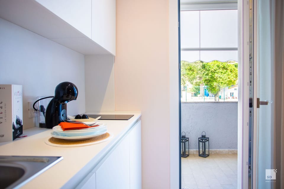Deluxe Apartment | Private kitchen | Espresso maker, dining tables