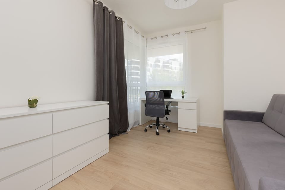 The bedroom's modern design ensures a comfortable stay. 