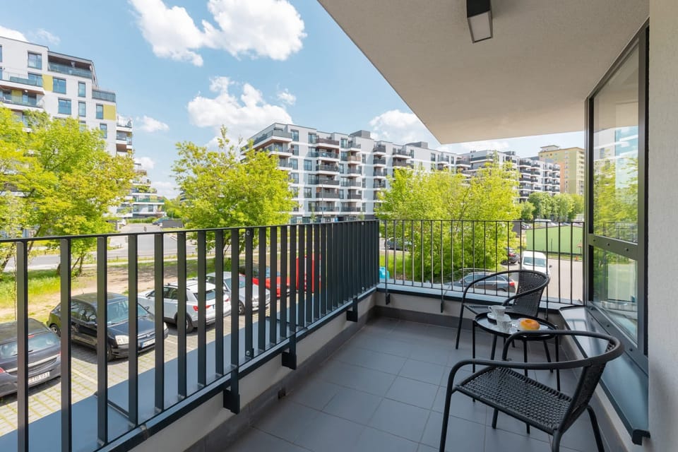 The balcony's stylish design complements the apartment's decor. 