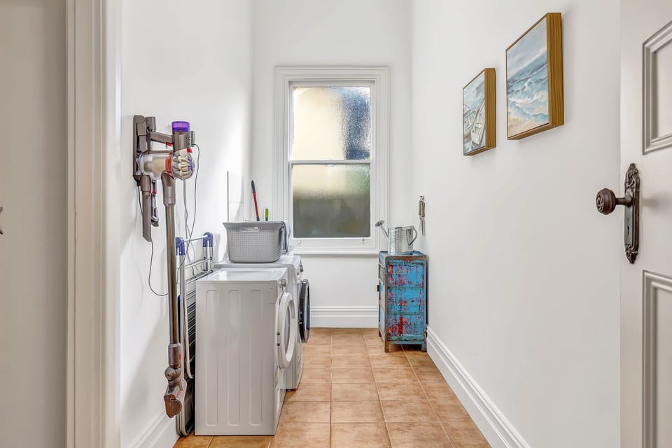 Convenient laundry room equipped with modern amenities.