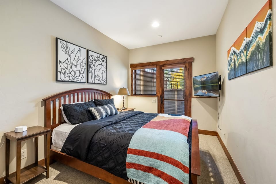 Lower level Queen bedroom (accessed from garage, under same roof as rest of home)