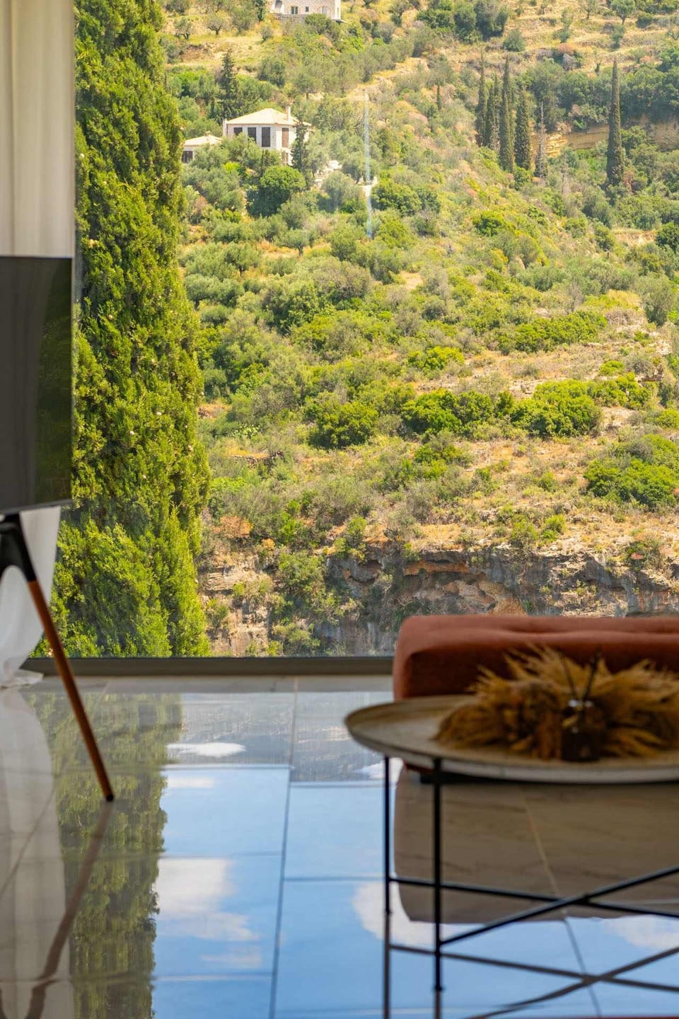 The spacious minimalistic living room with panoramic views