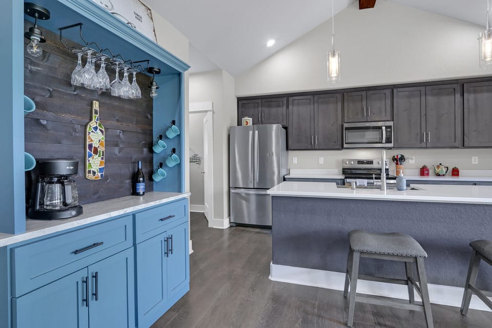 To the left of the kitchen is a large coffee bar.