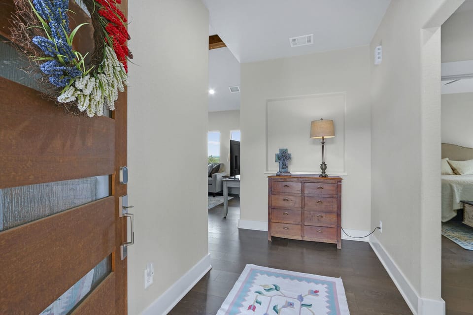 Entering the home you will see the living room off to the left and the hallway to bedrooms 2 and three to the right.